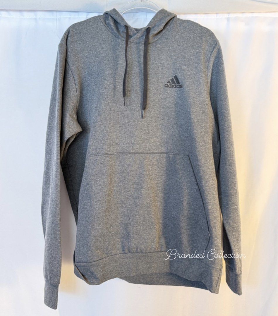 Adidas Grey Hoodie Sweatshirt (Category: Coats, Jackets and Outerwear) located in Manila. Submitted by usbrandedcollections (Listing ID 1447473737, Image 1). Description: Adidas SKU: CLT-ADS-0011 SKU: CLT-ADS-0012 Essentials Fleece Hoodie in Medium Grey Heather. Regular Fit. Drawcord adjustable hood. 70% cotton, 30% polyester. Ribbed cuffs and hem. Size: M & L 🚢 Sea Cargo It takes 3-4 mos for those who are willing to wait only. ✈️ Air Cargo take