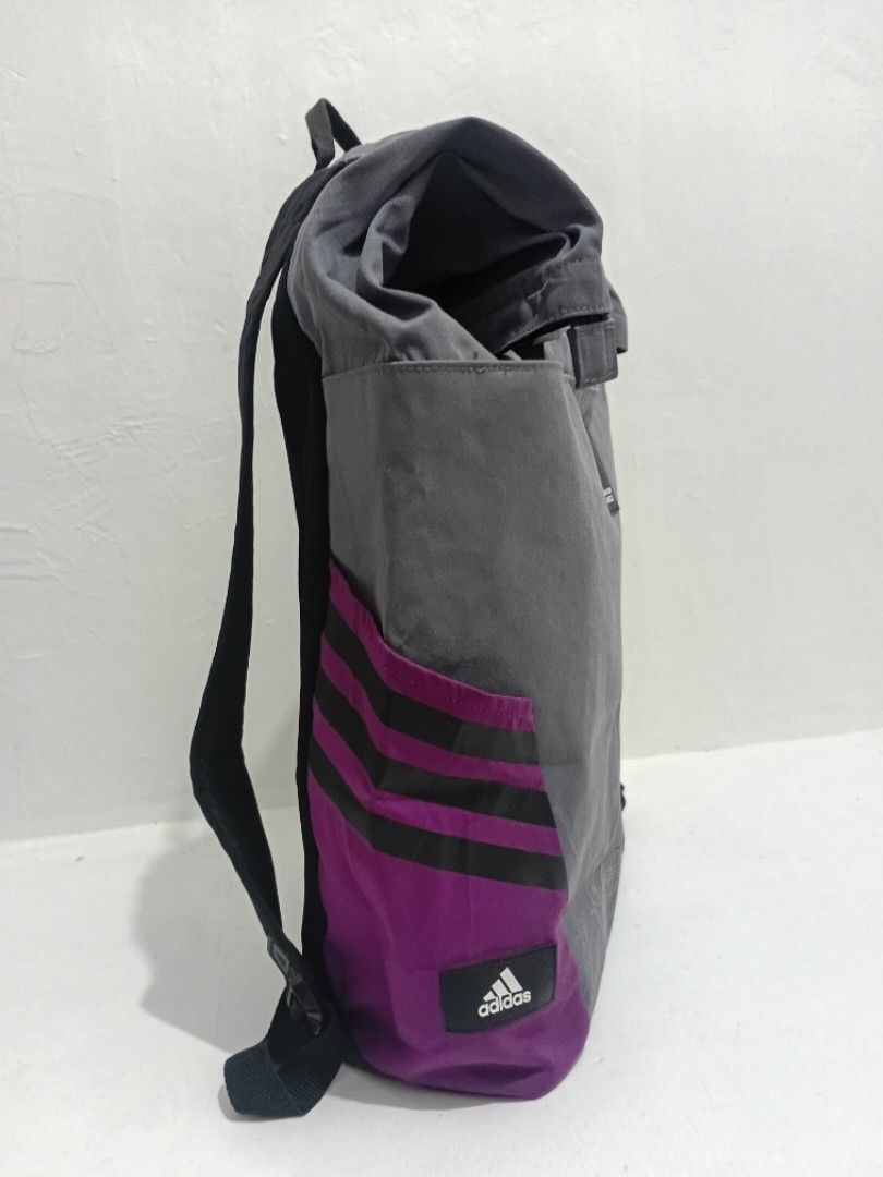 ADIDAS Roll Top Backpack (Category: Backpacks) located in Navotas City. Submitted by ms.soulana (Listing ID 1447604702, Image 2). Description: PreOwned Lightly Used Adidas OG Grey and purple Adidas roll top backpack 28L -Large - Features the official Qatar 2022 logo - Multiple pockets for organization - Adjustable straps for comfortable carrying - Ideal for school, daily commute, or travel - Made in Vietnam Good Condition 9/10.