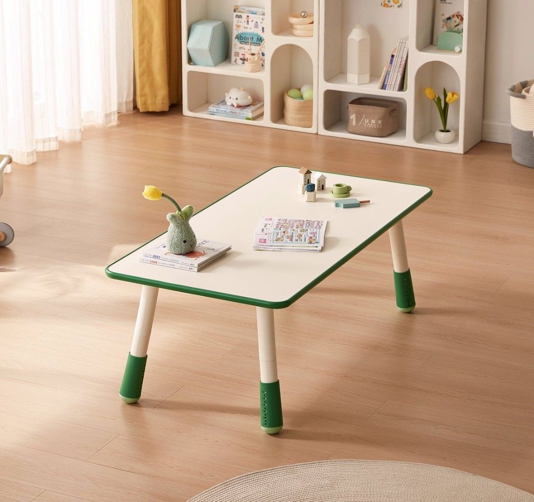 Adjustable Height Kids Study Table (Category: Tables & Sets) located in Singapore. Submitted by lovesummerlove (Listing ID 1447575421, Image 1). Description: - White and green kids table - Adjustable legs for height customization - Ideal for playtime or study sessions - Easy-to-clean surface - Sturdy and durable design - Perfect addition to your child's room.