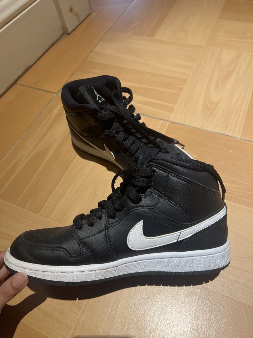 Authentic Air Jordan 1 Mid Black White Sneakers (Category: Sneakers) located in Bulacan. Submitted by fallongallon (Listing ID 1447540334, Image 3). Description: - Classic black and white colorway - Mid-top silhouette - Lace-up closure - Iconic Jumpman logo on tongue - Air Jordan Wings logo on ankle collar - White midsole with black outsole - Ideal for everyday wear 24cm.
