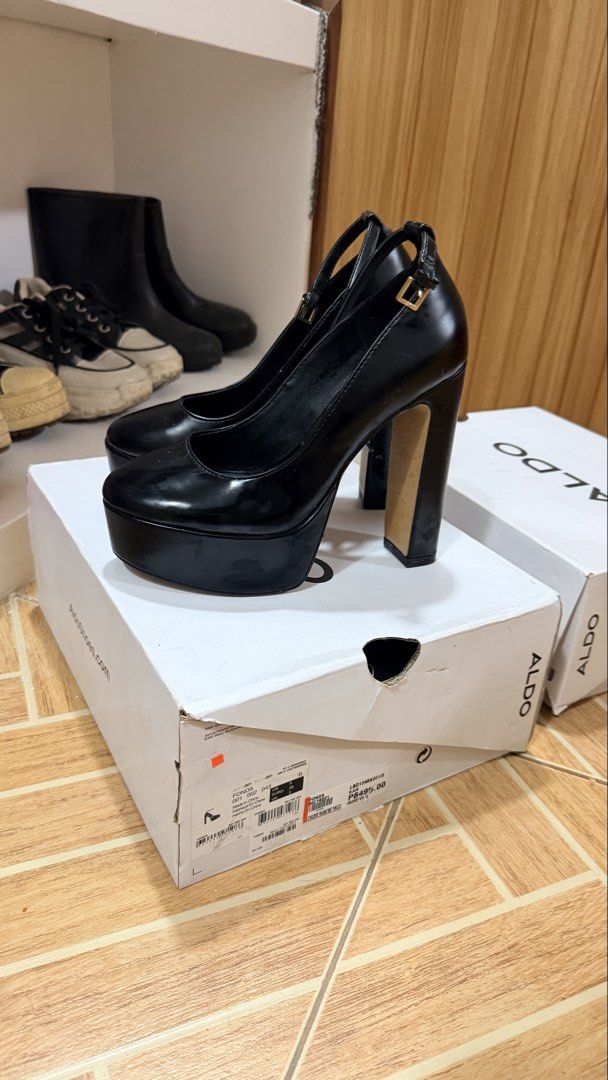 ALDO Black Platform Chunky Heel Shoes with Ankle Strap (Category: Heels) located in Subic. Submitted by franyb (Listing ID 1447672405, Image 1). Description: - Brand: ALDO - Type: Black platform heels - Features: Chunky block heel, ankle strap - Condition: Comes with original box and tissue paper - Size: 3 UK / 36 EUR - Perfect for dressing up any outfit.