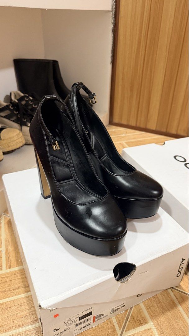 ALDO Black Platform Chunky Heel Shoes with Ankle Strap (Category: Heels) located in Subic. Submitted by franyb (Listing ID 1447672405, Image 2). Description: - Brand: ALDO - Type: Black platform heels - Features: Chunky block heel, ankle strap - Condition: Comes with original box and tissue paper - Size: 3 UK / 36 EUR - Perfect for dressing up any outfit.