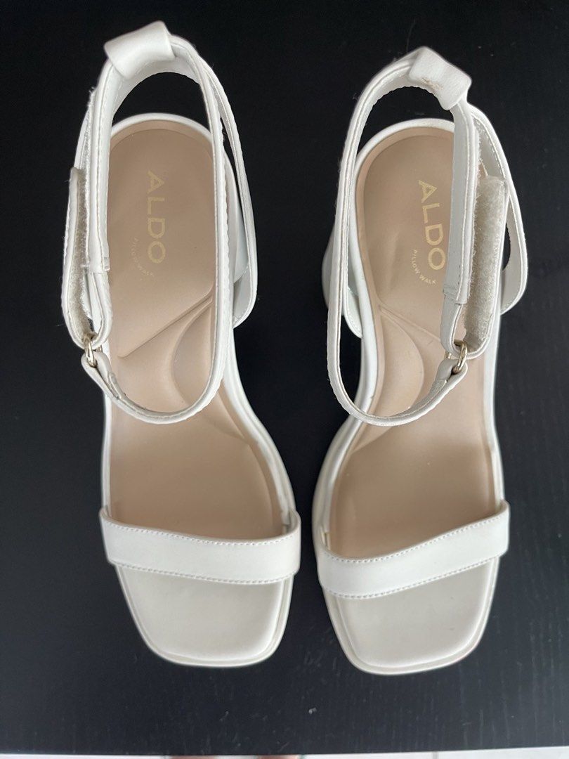 ALDO Wedding Shoes (Category: Heels) located in Mandaluyong City. Submitted by wenawonka (Listing ID 1447491621, Image 2). Description: - Brand: ALDO - Color: White/Bone - Style: Platform Sandals - Size: US 7.5 / EUR 38 - Features: Chunky block heel, adjustable ankle strap, square toe, padded insole - Worn once for my wedding, very comfortable, nice in photos - Needs a little cleaning or wiping only - Bought for 5,295.