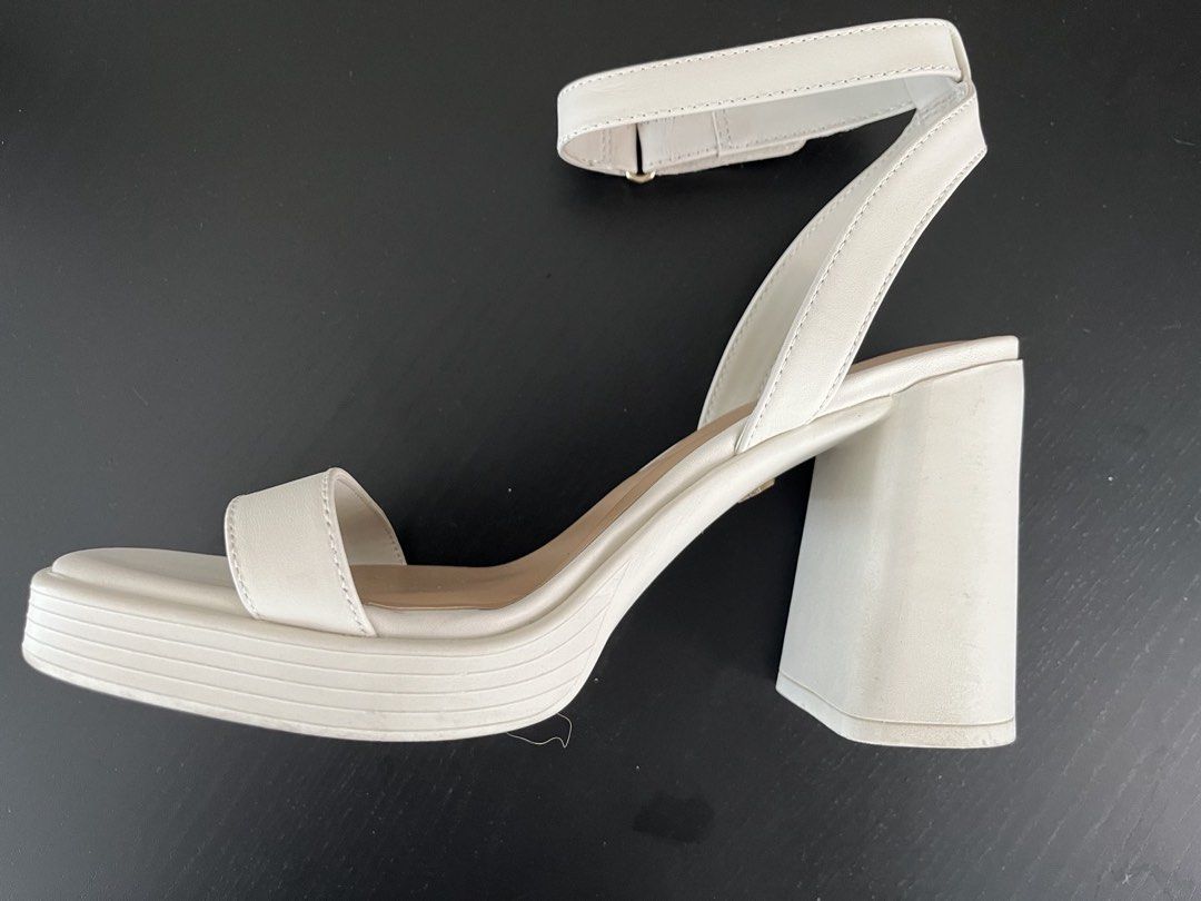ALDO Wedding Shoes (Category: Heels) located in Mandaluyong City. Submitted by wenawonka (Listing ID 1447491621, Image 1). Description: - Brand: ALDO - Color: White/Bone - Style: Platform Sandals - Size: US 7.5 / EUR 38 - Features: Chunky block heel, adjustable ankle strap, square toe, padded insole - Worn once for my wedding, very comfortable, nice in photos - Needs a little cleaning or wiping only - Bought for 5,295.