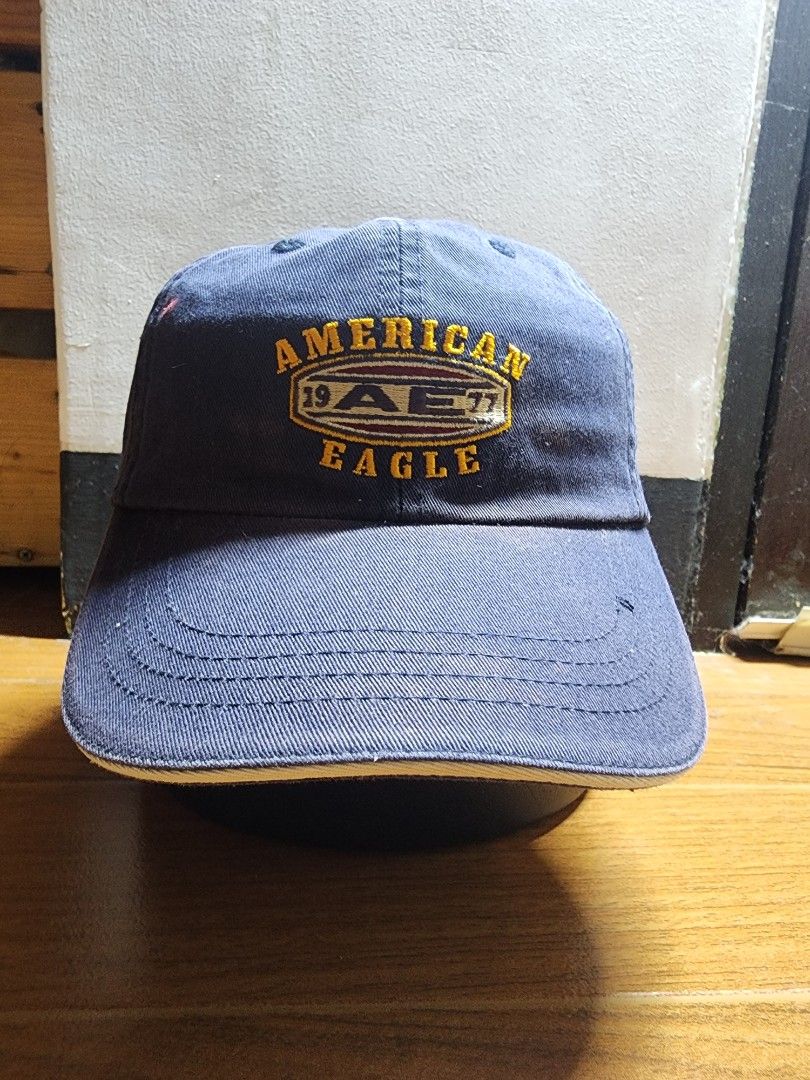 American Eagle AE Performance Navy Blue Cap (Category: Caps & Hats) located in Meycauayan. Submitted by MP_Shop (Listing ID 1447571878, Image 1). Description: - Navy blue American Eagle cap - AE Performance branding on front and side - Made of 100% cotton - One size fits all - Adjustable strap with metal buckle at the back - Ideal for everyday wear.