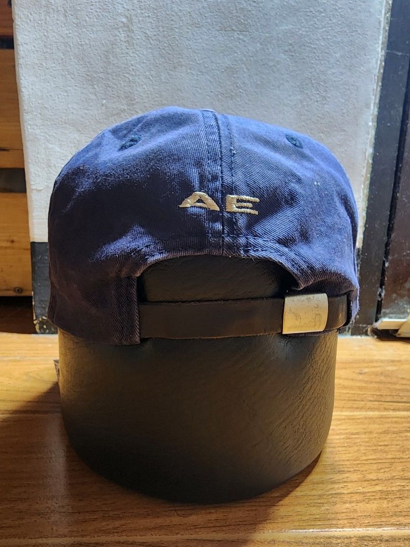 American Eagle AE Performance Navy Blue Cap (Category: Caps & Hats) located in Meycauayan. Submitted by MP_Shop (Listing ID 1447571878, Image 2). Description: - Navy blue American Eagle cap - AE Performance branding on front and side - Made of 100% cotton - One size fits all - Adjustable strap with metal buckle at the back - Ideal for everyday wear.
