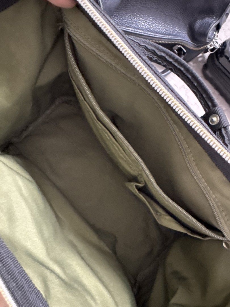 Anello Black Canvas (Category: Backpacks) located in Santiago. Submitted by sissy.declutter (Listing ID 1447511093, Image 3). Description: - Black Anello Sling - Durable canvas material - Front zipper pocket for quick access - Spacious main compartment with internal organization pockets - Adjustable straps for a comfortable fit - Ideal for everyday use Issue: has a small hole at the back/side J&T and Gcash Isabela Location .