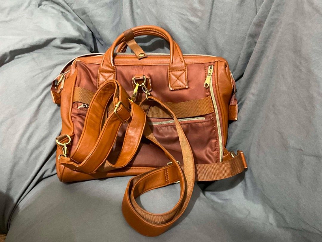 Anello Leather 3-way Bag Brown / Camel (Category: Cross-body Bags) located in Las Pinas. Submitted by de.clutterer_j9 (Listing ID 1447610381, Image 3). Description: 3-way: Backpack, Sling Bag, Hand-held Bag - Anello brown leather bag - Top handles and detachable shoulder strap - Multiple interior pockets for organization - Zippers are in good working condition - Signs of wear on handles and strap edges - Perfect for daily use! Fits iPad & Laptop.