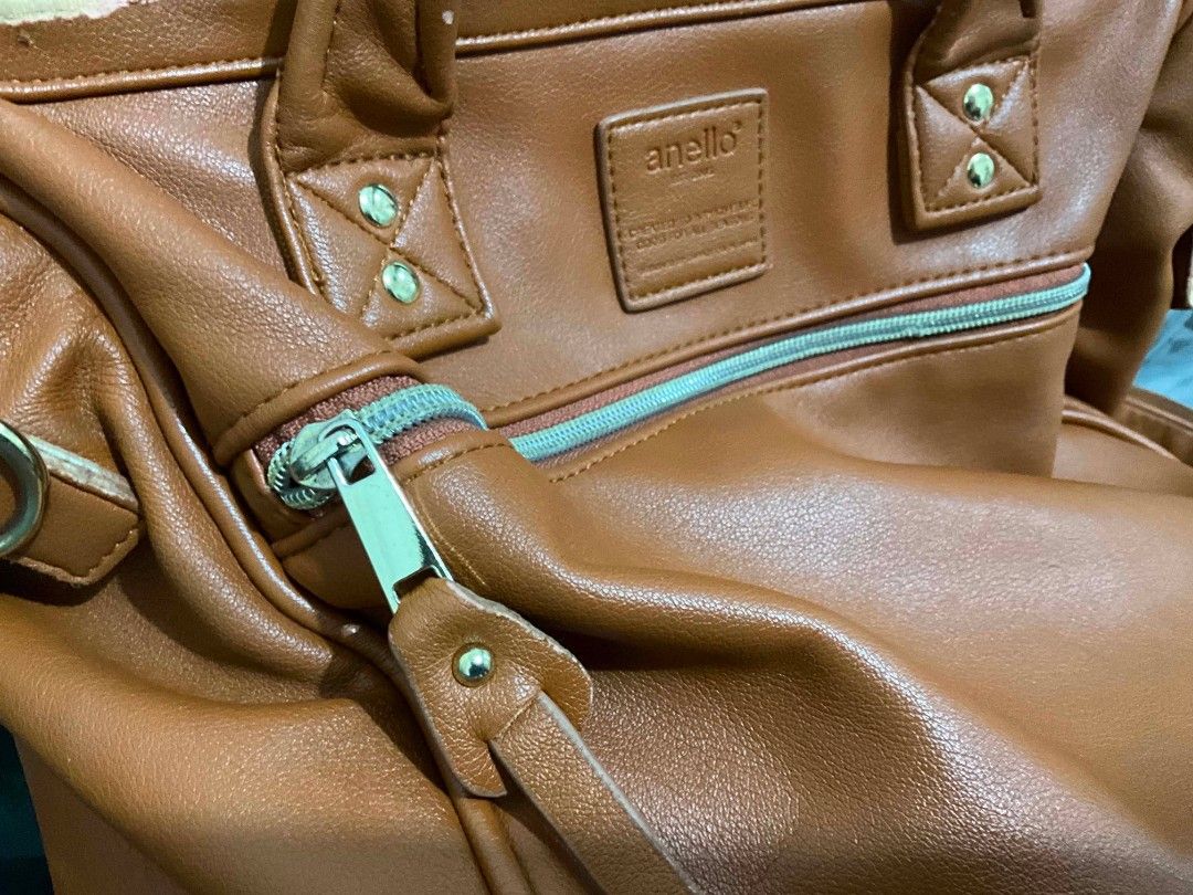 Anello Leather 3-way Bag Brown / Camel (Category: Cross-body Bags) located in Las Pinas. Submitted by de.clutterer_j9 (Listing ID 1447610381, Image 2). Description: 3-way: Backpack, Sling Bag, Hand-held Bag - Anello brown leather bag - Top handles and detachable shoulder strap - Multiple interior pockets for organization - Zippers are in good working condition - Signs of wear on handles and strap edges - Perfect for daily use! Fits iPad & Laptop.