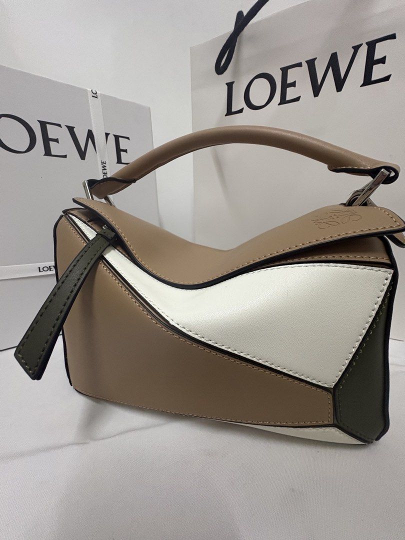 Authentic Loewe puzzle bag tricolor green white (Category: Luxury Bags & Wallets) located in Manila. Submitted by pursonalshopper (Listing ID 1447470697, Image 1). Description: Guaranteed authentic Complete inclusions Dustbag , box with loewe bow and paperbag included .