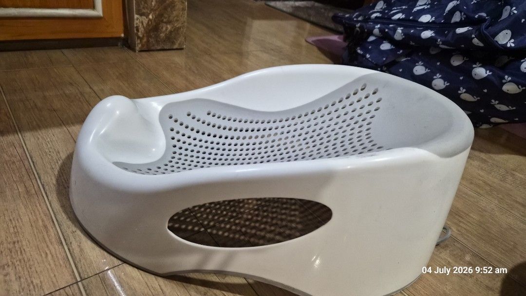Baby Bath newborn (Category: Bathtub & Bath Accessories) located in Pasig City. Submitted by missearly7 (Listing ID 1447487547, Image 1). Description: - White baby bath support with grey mesh insert - Designed for secure baby positioni - Features drainage holes for convenience - Simplifies bath time for parents - Easy to clean and store - safe for newborn rfs: no longer use. baby is already 11mos old :).