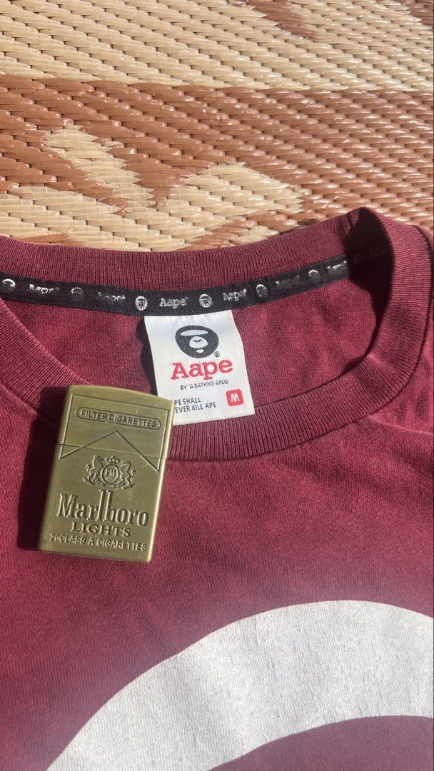 Basic Aape tee (Category: Activewear) located in Kuala Lumpur. Submitted by ridzqe1 (Listing ID 1447494708, Image 3). Description: 20.5x26.5 Has minor cracking on print Condition 8/10.