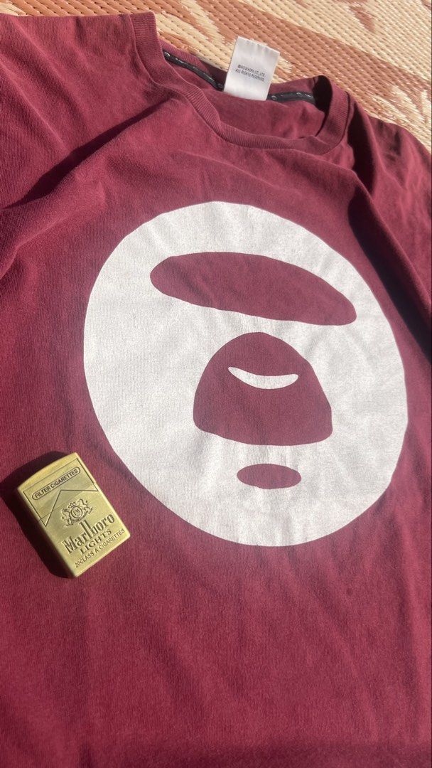 Basic Aape tee (Category: Activewear) located in Kuala Lumpur. Submitted by ridzqe1 (Listing ID 1447494708, Image 2). Description: 20.5x26.5 Has minor cracking on print Condition 8/10.