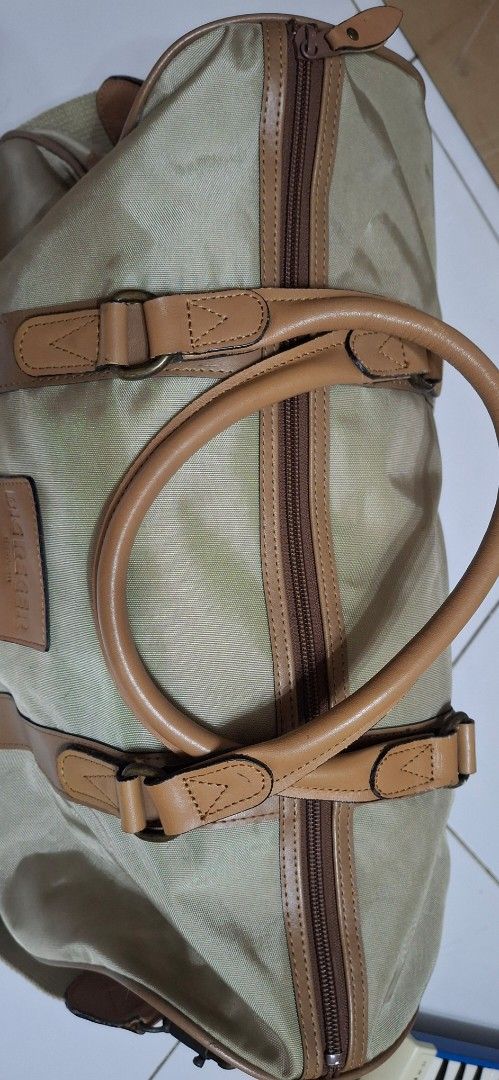 BIG REGER Canvas Leather Trim Duffel Bag (Category: Sling Bags) located in Manila. Submitted by youngcloud_b1fffa (Listing ID 1447667644, Image 3). Description: - Classic beige canvas duffel bag - Tan leather trim and handles - Detachable shoulder strap included - Zippers are in good working condition - Perfect size for weekend getaways or gym sessions - Shows minor marks on canvas, but overall in good shape - Ready for your next adventure! "R&B 