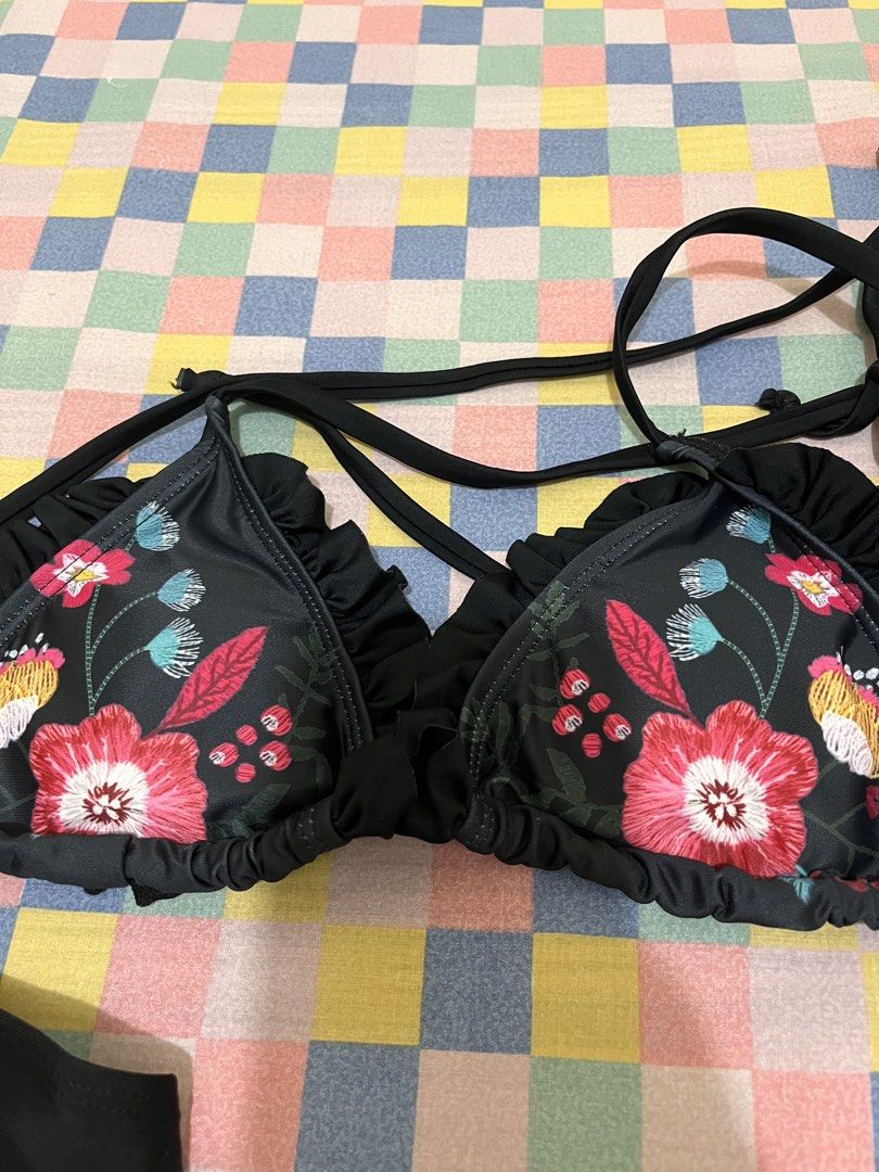 Black Floral Bikini Set with Ruffle Trim - Size M (Category: Bikinis & Swimsuits) located in Quezon City. Submitted by htebesor12 (Listing ID 1447518208, Image 3). Description: - Cute black bikini set - Floral embroidered design on triangle cups - Ruffle trim along edges - Ties at neck and back - Smocked waistband on bottoms - Size M - Ideal for beach or pool.