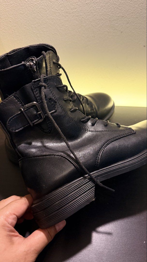 Black Lace-Up Combat Boots with Side Zip (Category: Boots) located in Kuala Lumpur. Submitted by kayhani (Listing ID 1447598722, Image 3). Description: - Black combat boots - Lace-up front with side zipper for easy on/off - Stylish buckle detail on the side - Chunky sole for a trendy look - Versatile for everyday wear.