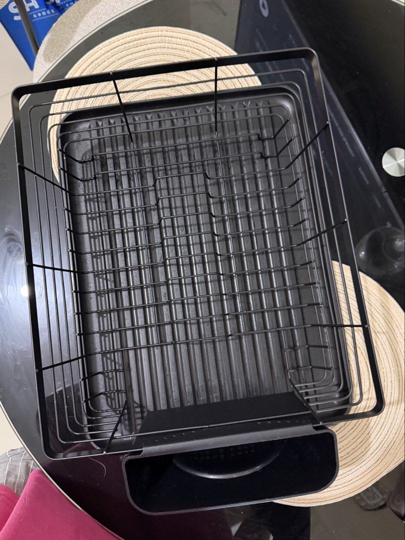 Black Metal Dish Rack with Utensil Holder (Category: Other Kitchenware & Tableware) located in Manila. Submitted by eyngel9657 (Listing ID 1447506367, Image 2). Description: Bought last June 2026 and only used for almost 1 week but barely placed anything RFS: too big for my sink - Sleek black metal dish rack - Includes a removable utensil holder for easy cleaning - Grooved tray for efficient water drainage - Perfect for organizing your kitchen si