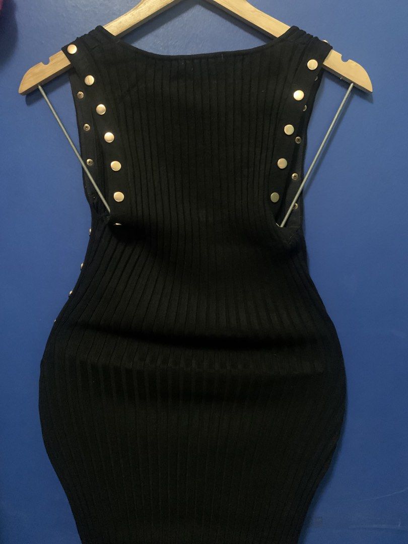 Black Ribbed Dress with Gold Studs (Category: Dresses) located in Malabon City. Submitted by vewonica (Listing ID 1447512514, Image 3). Description: - Sleeveless black ribbed dress - Features stylish gold stud details on sides and shoulders - Stretchy and form-fitting material - Ideal for night outs or parties - Approximately 30 inches in length (shoulder to hem).