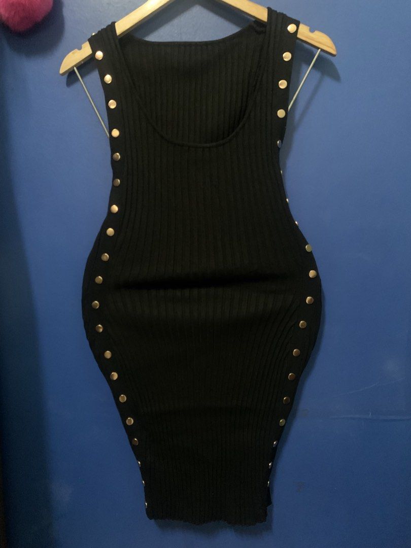 Black Ribbed Dress with Gold Studs (Category: Dresses) located in Malabon City. Submitted by vewonica (Listing ID 1447512514, Image 1). Description: - Sleeveless black ribbed dress - Features stylish gold stud details on sides and shoulders - Stretchy and form-fitting material - Ideal for night outs or parties - Approximately 30 inches in length (shoulder to hem).
