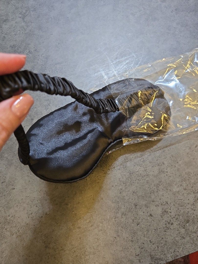 Black Satin Sleep Mask with Elastic Strap (Category: Face Masks & Face Shields) located in Kuala Lumpur. Submitted by kllyjoss61333 (Listing ID 1447636458, Image 1). Description: - Brand new black satin sleep mask - Soft, elasticated strap for comfort - Comes in original packaging - Ideal for travel or home use - Effectively blocks out light.