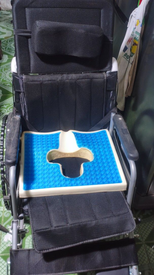 Black Wheelchair with Headrest and Cushion (Category: Wheelchairs) located in Caloocan City. Submitted by luluonlineshop (Listing ID 1447559094, Image 3). Description: For sale. - Black wheelchair with headrest for added support - Includes a comfortable blue gel cushion with a cutout - Adjustable armrests and footrests for personalized comfort - Sturdy wheels, ready for immediate use - Ideal for reliable mobility assistance.