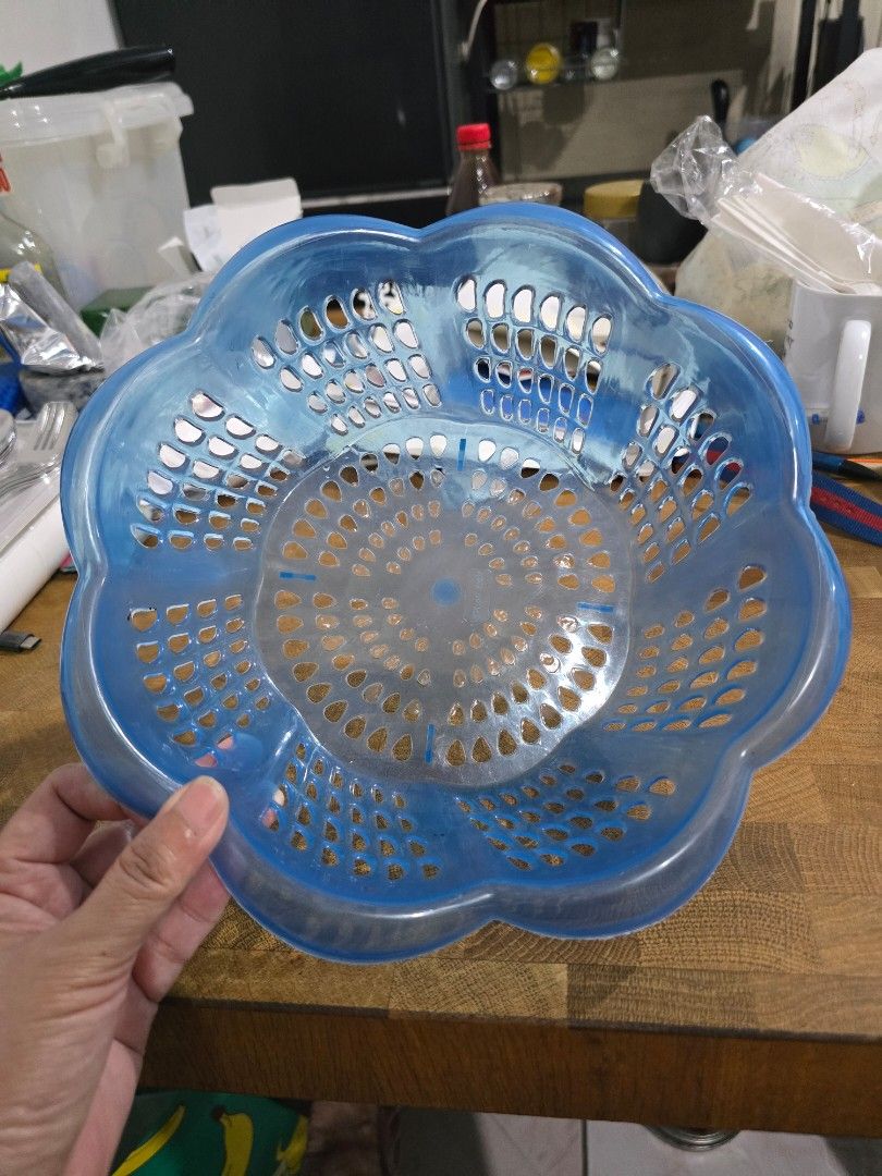 Blue Flower Shaped Plastic Basket (Category: Storage Boxes & Baskets) located in Makati City. Submitted by shopaholicsgallery (Listing ID 1447598230, Image 1). Description: - Blue plastic basket with a charming flower shape. - Features numerous holes for excellent drainage, ideal for washing fruits and vegetables. - Versatile use for storage purposes. - Simple to clean and maintain. - Lightweight yet durable construction. - RFS: decluttering.