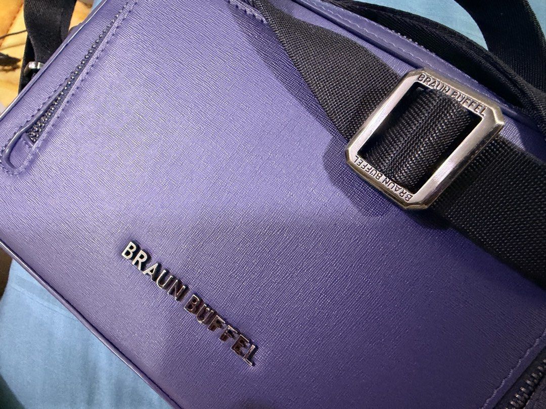 Braun Buffel Purple Crossbody Bag (Category: Bags & Wallets) located in Kuala Lumpur. Submitted by kelvmks (Listing ID 1447596051, Image 1). Description: - Authentic purple Braun Buffel crossbody bag - Multiple zippered compartments for secure storage - Adjustable strap for comfortable wear - Textured material with a stylish finish - Ideal for everyday use Original price 1450.