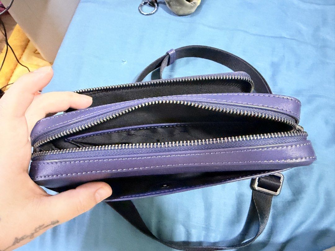 Braun Buffel Purple Crossbody Bag (Category: Bags & Wallets) located in Kuala Lumpur. Submitted by kelvmks (Listing ID 1447596051, Image 2). Description: - Authentic purple Braun Buffel crossbody bag - Multiple zippered compartments for secure storage - Adjustable strap for comfortable wear - Textured material with a stylish finish - Ideal for everyday use Original price 1450.