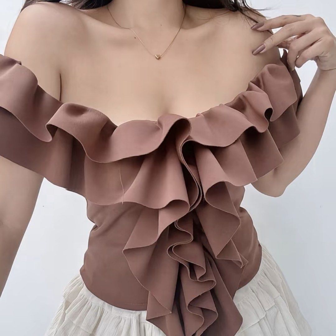 Brown Off-Shoulder Ruffle Top (Category: Blouses) located in Manila. Submitted by steff_33 (Listing ID 1447654092, Image 1). Description: - never worn - fits xs-m .