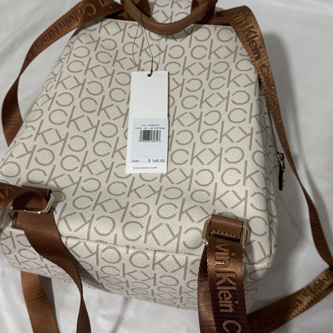 Brand New Calvin Klein Monogram Backpack (Category: Backpacks) located in Las Pinas. Submitted by randomnanything (Listing ID 1447505637, Image 3). Description: - Authentic Calvin Klein monogram backpack - Chic color combination: White and Beige - Elegant gold color hardware details - Adjustable straps with signature Calvin Klein branding - Practical interior zippered pocket - Unused/ Brand new with original tags attached - Original Price: around