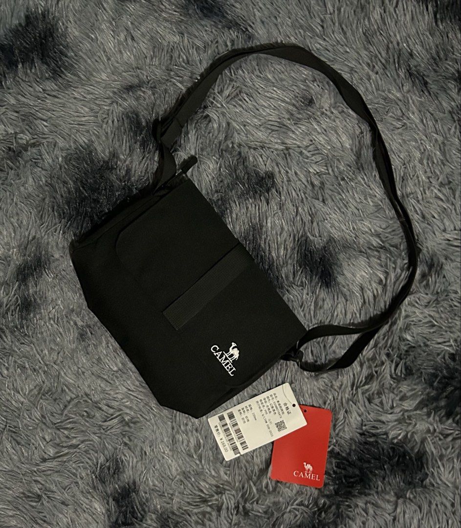 Camel Black Crossbody Bag W9 L8 (Category: Sling Bags) located in Cadiz. Submitted by jaybatiller (Listing ID 1447511206, Image 2). Description: - Brand: Camel - Color: Black - Material: Fabric - Style: Crossbody bag - Features: Adjustable strap - Condition: Brand new with tags attached - Ideal for: Everyday use.