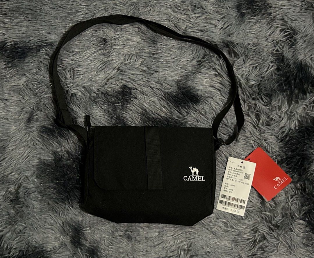 Camel Black Crossbody Bag W9 L8 (Category: Sling Bags) located in Cadiz. Submitted by jaybatiller (Listing ID 1447511206, Image 1). Description: - Brand: Camel - Color: Black - Material: Fabric - Style: Crossbody bag - Features: Adjustable strap - Condition: Brand new with tags attached - Ideal for: Everyday use.