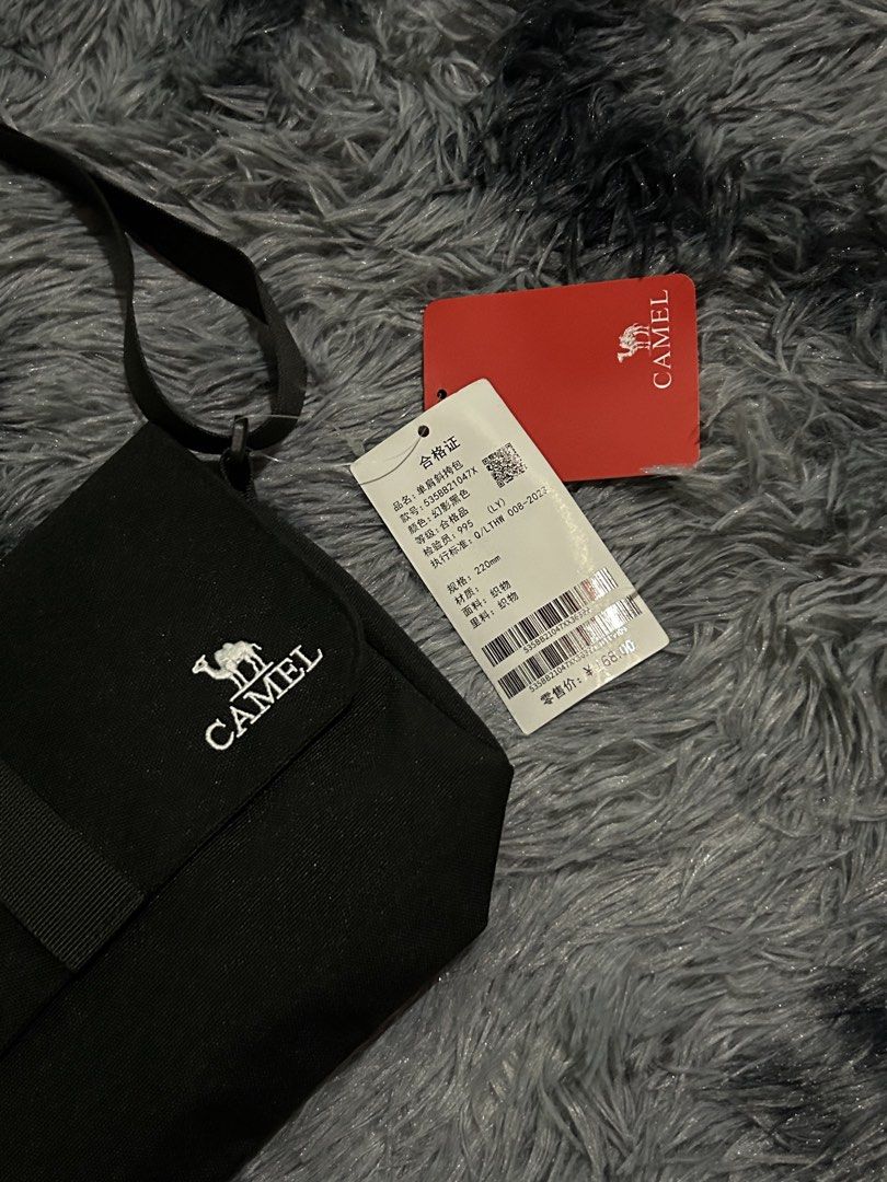 Camel Black Crossbody Bag W9 L8 (Category: Sling Bags) located in Cadiz. Submitted by jaybatiller (Listing ID 1447511206, Image 3). Description: - Brand: Camel - Color: Black - Material: Fabric - Style: Crossbody bag - Features: Adjustable strap - Condition: Brand new with tags attached - Ideal for: Everyday use.
