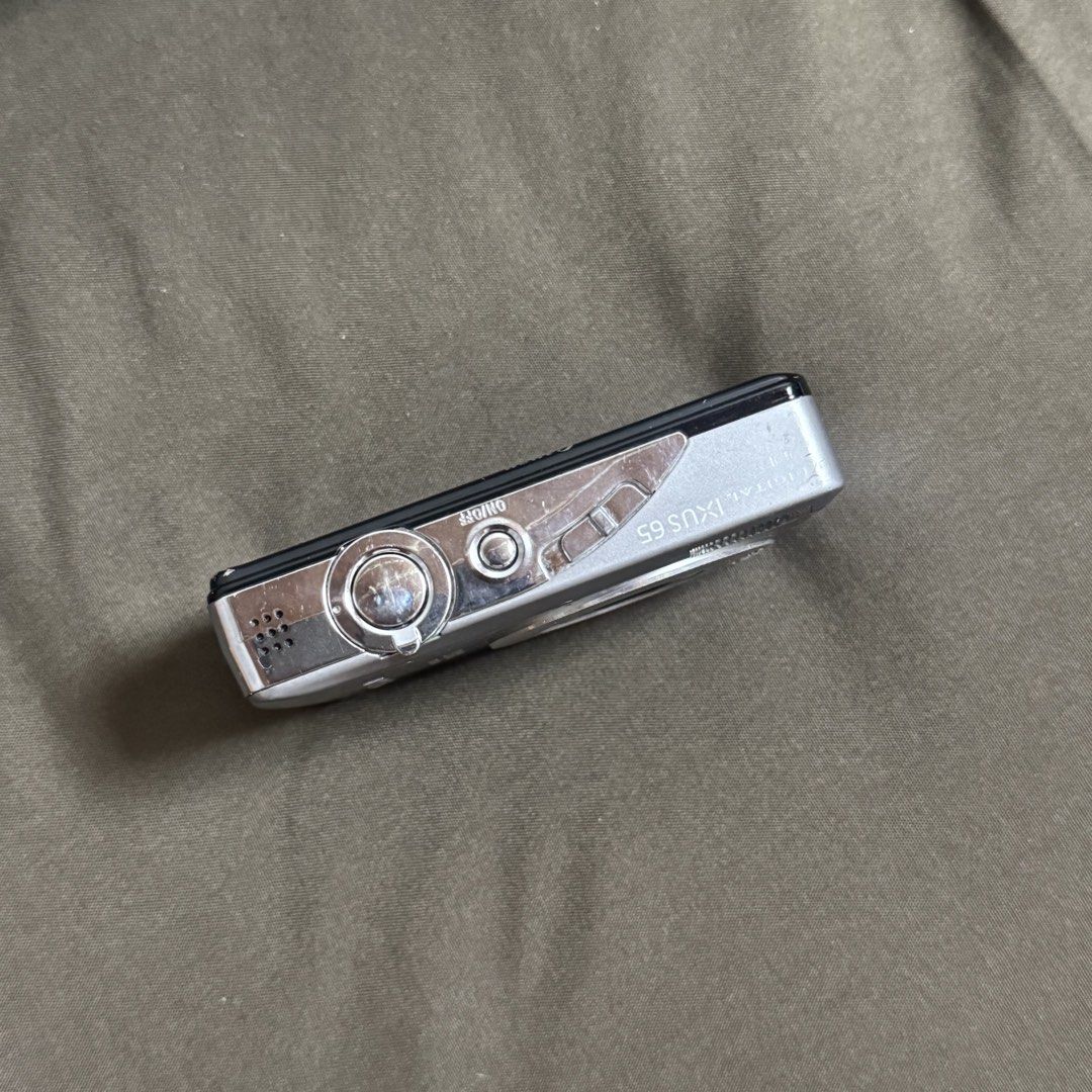 Canon Digital IXUS 65 Camera (Category: Cameras) located in Pasay City. Submitted by minrkluvs (Listing ID 1447589076, Image 3). Description: Canon Digital IXUS 65 Digi Camera Digi Cam - Fully functional - Working flash - All buttons are working - With battery, charger, A/V cable, CD’s, box and manuals. - 6.0 megapixels - CCD - 3x optical zoom - 3 inch LCD - Please do search the net for complete specs. - message me for pic samples! Issue: The cam