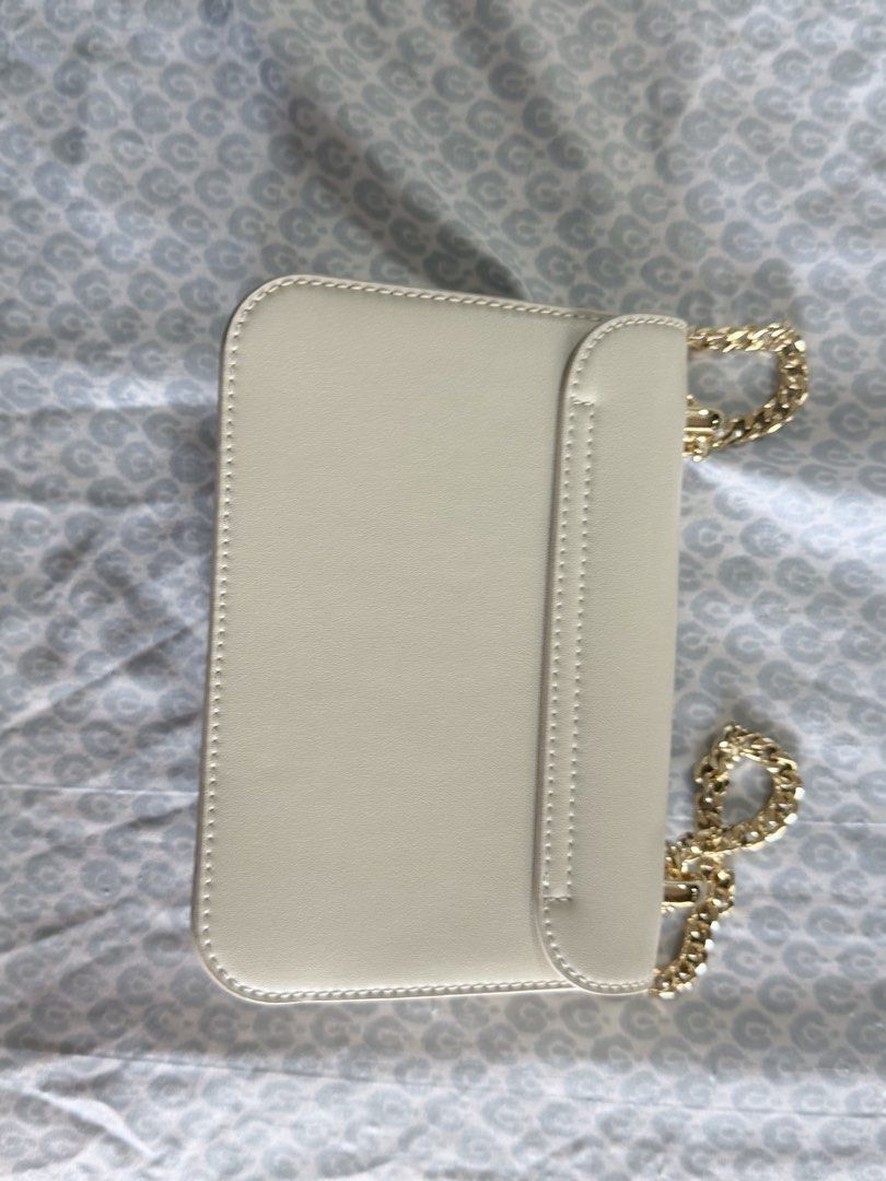 Charles & Keith Quilted Chain Shoulder Bag Cream (Category: Shoulder Bags) located in Quezon City. Submitted by fabeelousph (Listing ID 1447479142, Image 2). Description: - Cream quilted shoulder bag - Gold chain strap - Classic turn-lock closure - Compact size, ideal for essentials - Great for evening events - Clean interior - Minimal signs of wear.