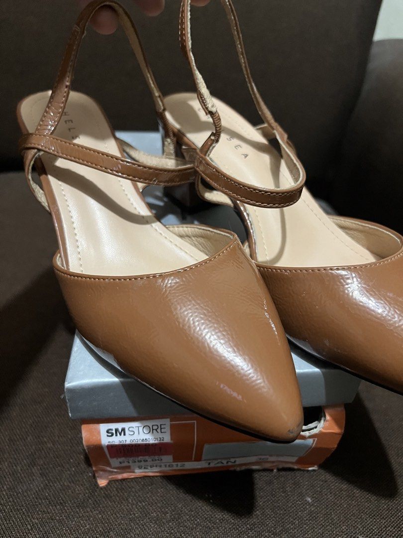 Chelsea Tan Pointed Toe Slingback Heels Size 36 (Category: Heels) located in San Jose. Submitted by zaaspreloved (Listing ID 1447611185, Image 1). Description: - Brand: Chelsea - Style: Tan Pointed Toe Slingback Heels - Size: 36 - Features: Ankle strap, block heel - Condition: Comes with original box - Versatility: Perfect for dressing up or down.
