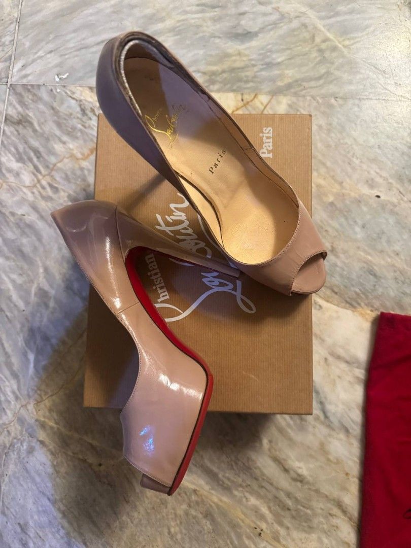 Christian Louboutin Peep-Toe Heels (Category: Heels) located in Makati City. Submitted by kateeyap (Listing ID 1447632525, Image 1). Description: - Classic Christian Louboutin peep-toe heels - Nude/beige patent leather - Iconic red soles - Includes original box and dust bag - Barely worn but has been in the box for years. More pictures available upon request. - Needs some TLC hence selling low. price is still slighly negotiable..