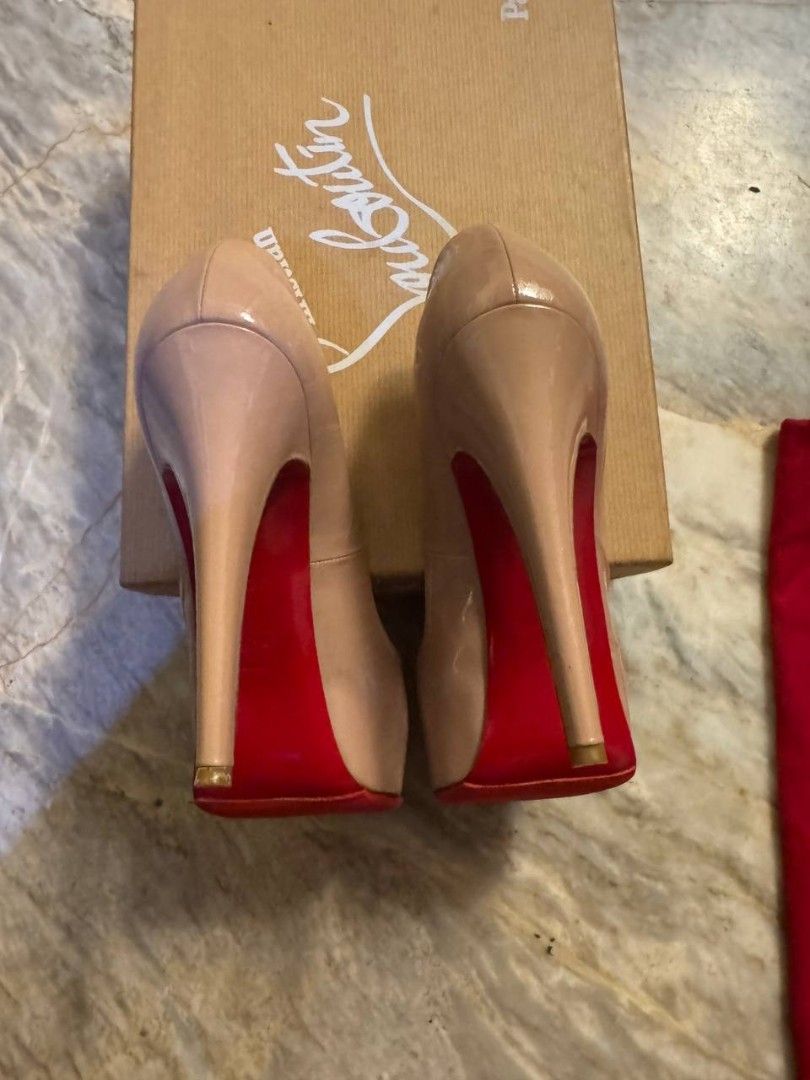 Christian Louboutin Peep-Toe Heels (Category: Heels) located in Makati City. Submitted by kateeyap (Listing ID 1447632525, Image 3). Description: - Classic Christian Louboutin peep-toe heels - Nude/beige patent leather - Iconic red soles - Includes original box and dust bag - Barely worn but has been in the box for years. More pictures available upon request. - Needs some TLC hence selling low. price is still slighly negotiable..