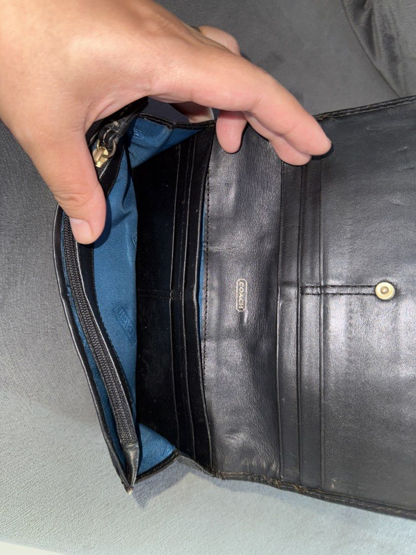 Coach Signature C Monogram Wallet (Category: Luxury Bags & Wallets) located in Himamaylan. Submitted by EsClosetCleanUp (Listing ID 1447675804, Image 3). Description: - Classic Coach wallet with signature C monogram pattern. - Color: Black fabric with black leather trim. - Interior: Multiple card slots and a zippered coin pocket. - Closure: Secure snap closure. - Condition: Shows some signs of wear on edges and interior, but plenty of life left. 