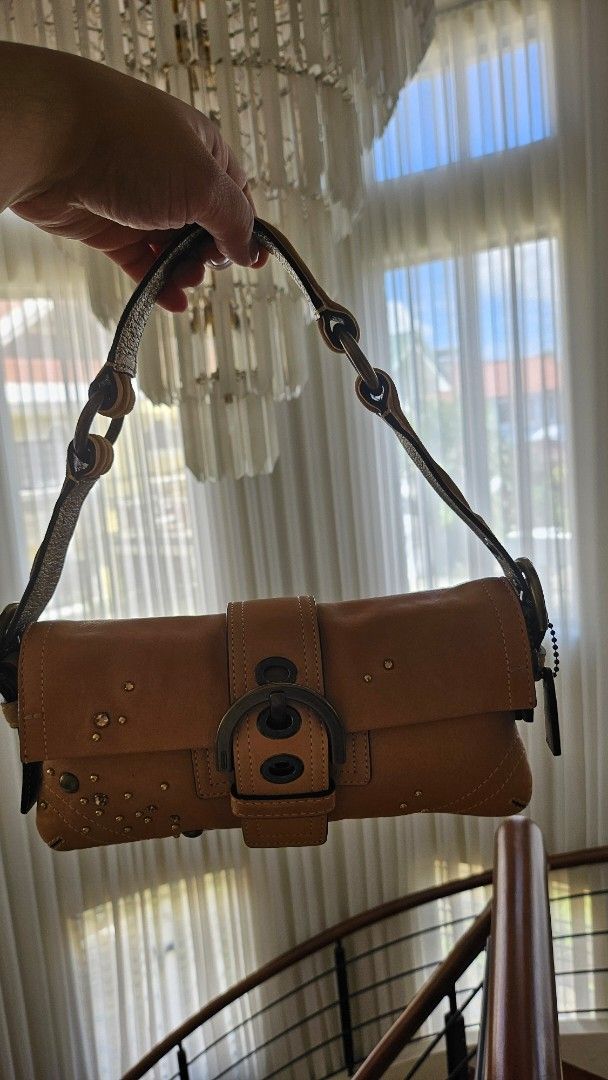 Coach Soho Demi Flap (Category: Luxury Bags & Wallets) located in Quezon City. Submitted by smariemerc46809 (Listing ID 1447503011, Image 3). Description: - Authentic Coach Soho Demi Flap - Stylish buckle closure - All-over decorative stud and rhinestones embellishments - Preloved Excellent condition.