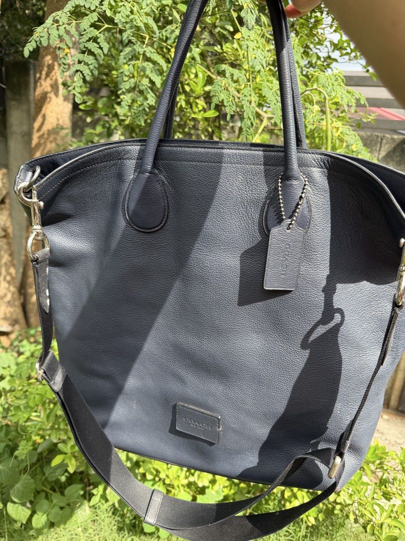 COACH XL NAVY BLUE CARRY ALL BAG (Category: Luxury Bags & Wallets) located in General Santos City (Dadiangas). Submitted by prelovedpickers (Listing ID 1447532277, Image 1). Description: XL Size Navy blue Coach leather tote. 15x14x4.5” Good pre-owned condition Pebbled leather Zip closure 2 short carrying handles 1 long strap Coach tag attached 3 inner compartments Kasya Laptop 16 inches perfect for work bag ..
