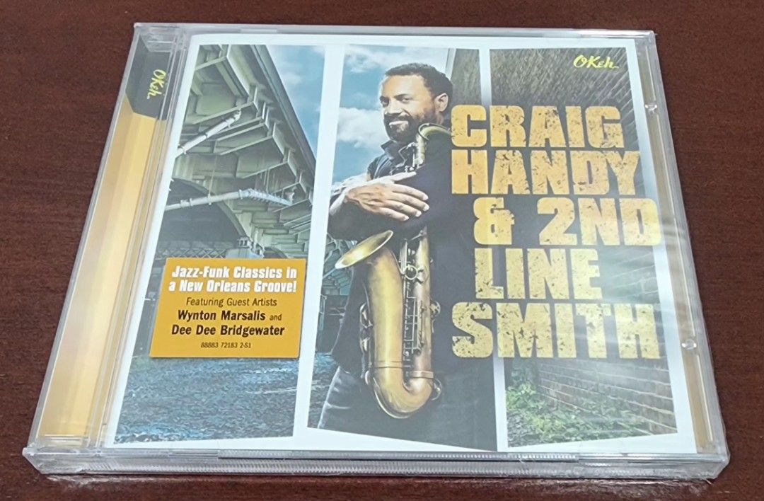 Craig Handy & 2nd Line Smith - Jazz-Funk Classics CD (Category: CDs & DVDs) located in Las Pinas. Submitted by aiyah2025 (Listing ID 1447622696, Image 2). Description: - Craig Handy & 2nd Line Smith CD - Jazz-Funk Classics with a New Orleans Groove - Featuring Wynton Marsalis and Dee Dee Bridgewater - Includes tracks: 'Minor Chant', 'Organ Grinder's Swing', 'Walking Head' - Produced by Craig Handy - Released on Okeh Records.
