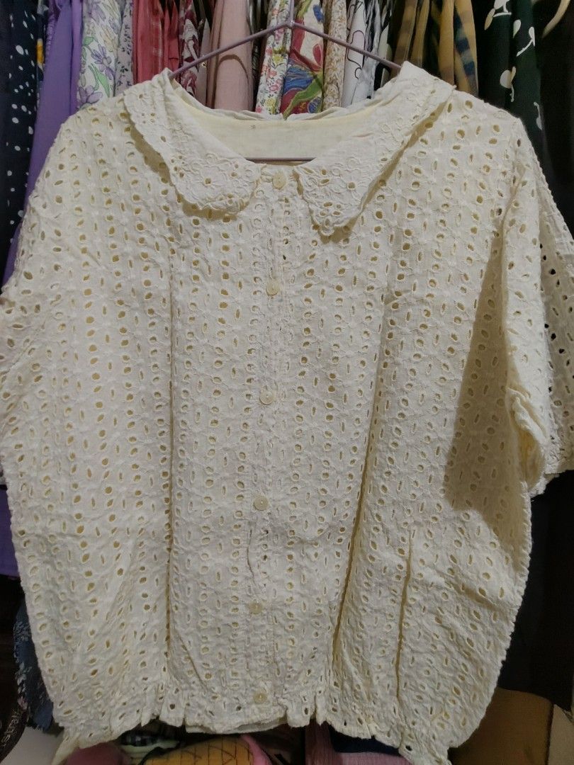 Cream Eyelet Peter Pan Collar Short Sleeve Blouse (Category: Blouses) located in Manila. Submitted by jadmcl (Listing ID 1447602804, Image 1). Description: - Cream collar - Short sleeves - Button-up front - Ruffled elastic hem detail - Sweet and vintage aesthetic - Versatile for casual or dressed-up occasions.