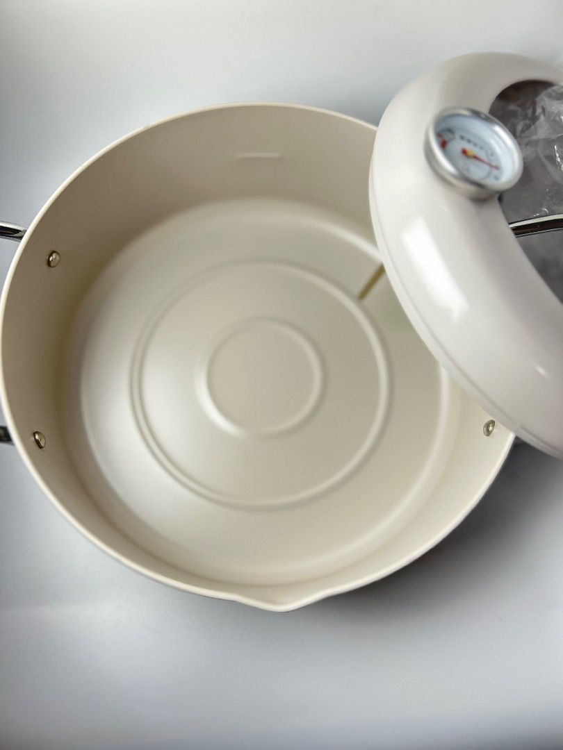 Cream Pot with Built-in Thermometer (Category: Cookers) located in Taguig. Submitted by Rare_findsmnl (Listing ID 1447470089, Image 3). Description: Nitori deep fryer or tempura pot ₱1100 Brand New Compatible to gas and induction stoves 8”x3.2” - Cream colored pot with handles - Lid features a built-in thermometer for accurate temperature monitoring - Ideal for cooking and deep frying - Easy to use and a great addition to any kitchen - Instructio