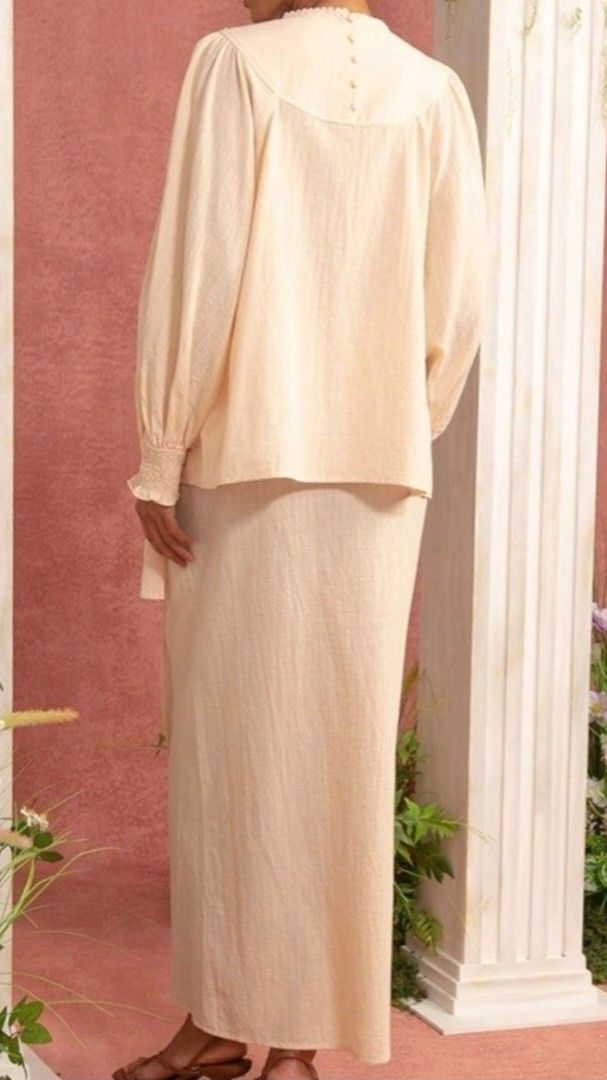 Cream Textured Long Sleeve Top & Skirt Set (Category: Sets or Coordinates) located in Kuala Lumpur. Submitted by hodorable (Listing ID 1447574255, Image 3). Description: - Cream textured top with puff sleeves and smocked cuffs. - Delicate floral embroidery around the neckline - Matching cream textured skirt with a wrap-style front. - Perfect for casual or semi-formal occasions. - Please refer to the size chart for accurate measurements. - Wrap sk