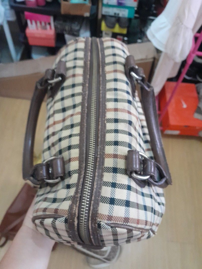 Daks doctors bag (Category: Cross-body Bags) located in Angeles City. Submitted by declutterhub (Listing ID 1447494686, Image 2). Description: Classic checkered barrel bag with brown leather trim. Zipper closure, interior pockets, and protective bottom studs. Perfect for daily use..