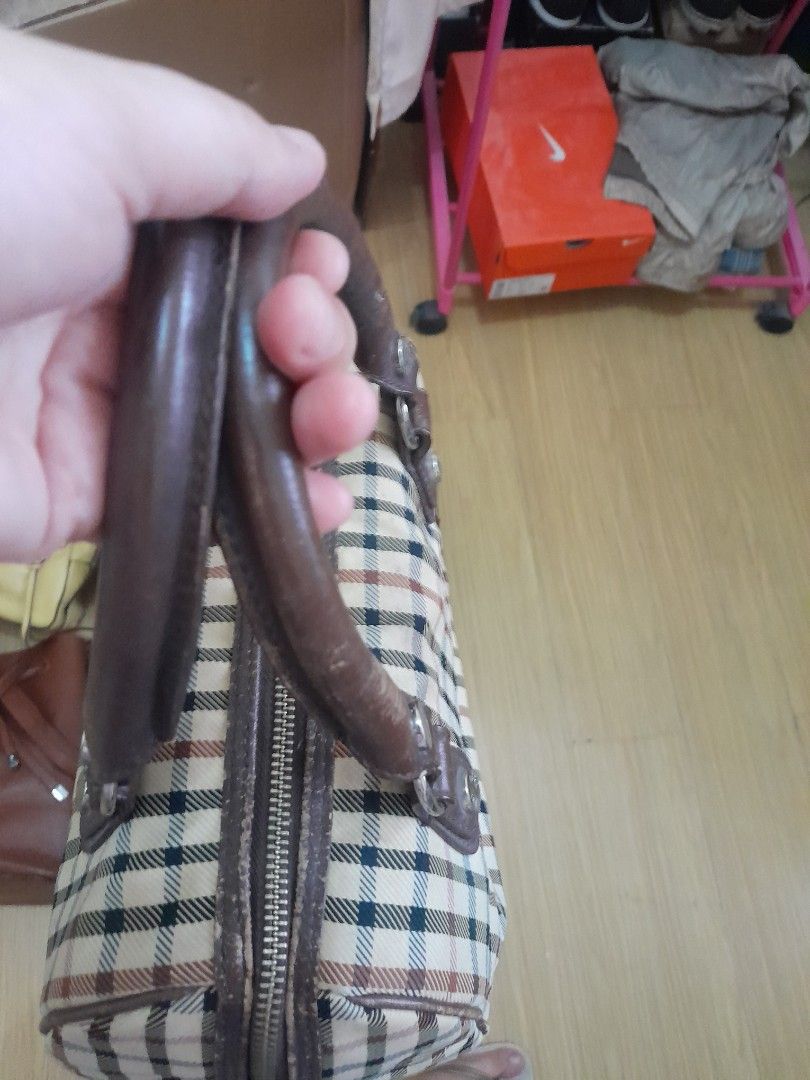 Daks doctors bag (Category: Cross-body Bags) located in Angeles City. Submitted by declutterhub (Listing ID 1447494686, Image 1). Description: Classic checkered barrel bag with brown leather trim. Zipper closure, interior pockets, and protective bottom studs. Perfect for daily use..