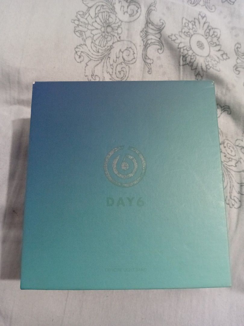DAY6 Official Lightband Version 1 (Category: Music Accessories) located in Batangas. Submitted by rj.btst_ (Listing ID 1447607780, Image 1). Description: FOR SHIPPING: 500 + local shipping fee *Buyers will shoulder shipping fee FOR MEET UP: 500 + 150 handling fee Packaging Outbox has dents, creases, and scratches since it was stored for a long time and the logo and band name on the box is already worn out. The Lightband is still in fine condition