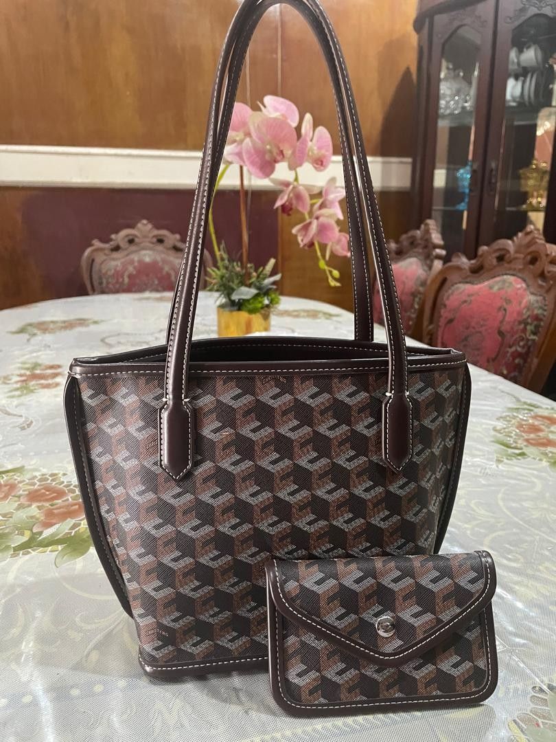 Designer Tote Bag with Matching Pouch (Category: Tote Bags) located in Kuala Lumpur. Submitted by yusianasya55715 (Listing ID 1447601832, Image 3). Description: - Classic brown monogram tote bag - Includes a matching small pouch - Sturdy handles, great for daily use - Pouch features a convenient snap closure - Ideal set for organizing your essentials.