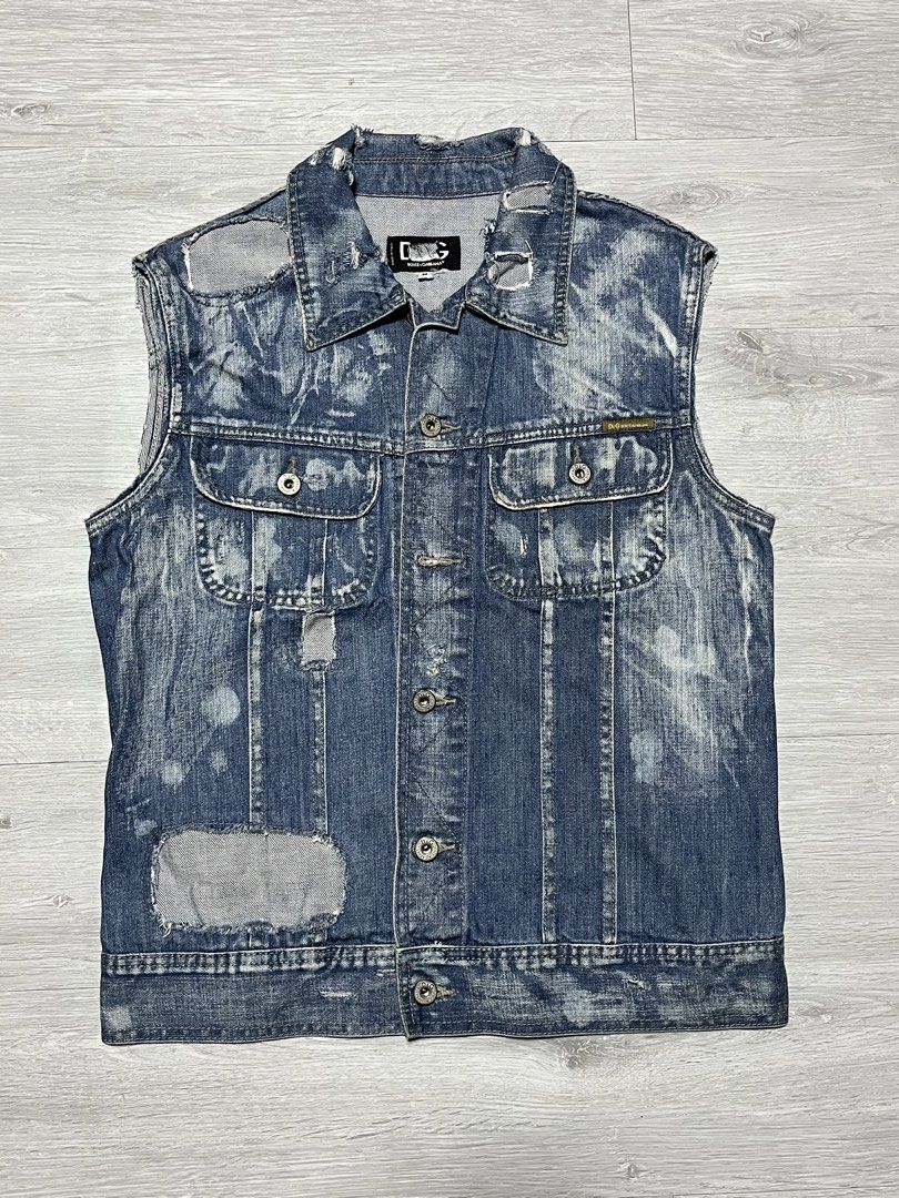 D&G Distressed Denim Vest (Category: Vests) located in Manila. Submitted by jorgemabelin2001 (Listing ID 1447486740, Image 1). Description: - Authentic D&G distressed denim vest - Blue wash with unique white splatters and ripped details - Sleeveless design with classic button-up front - Features two chest pockets with secure button closures - Ideal for layering over t-shirts or hoodies for a cool streetwear vibe.